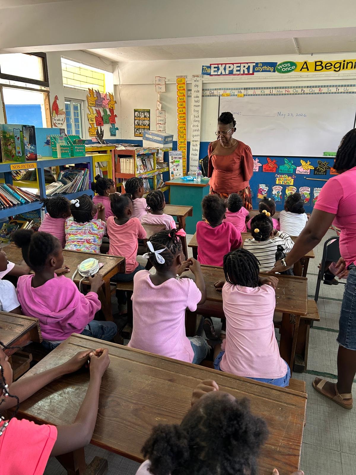 Primary school students learning together in a classroom